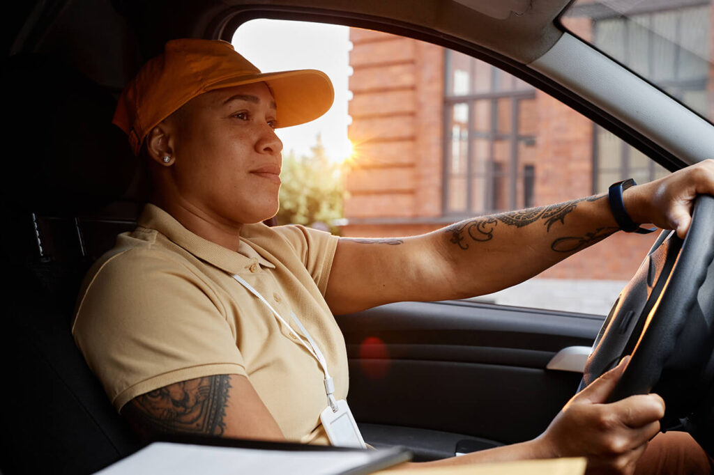Delivery person driving a van